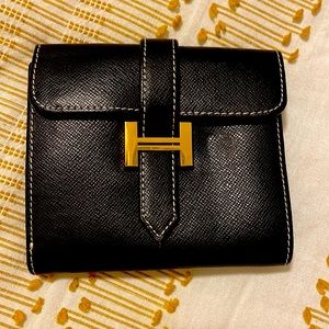 Hermes trifold wallet. Black leather . Smells delicious! Barely used .